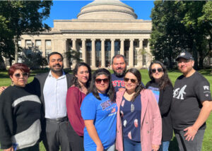 Group of Chilean teachers participating in the ChileMass Online program posing in front of the main building at MIT during their immersion visit to innovation centers in the United States.